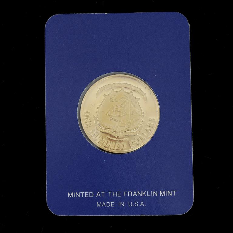 MINNESMYNT, 21,6 K guld, 100 dollar, Liberia, 1977. Vikt ca 10,9g.