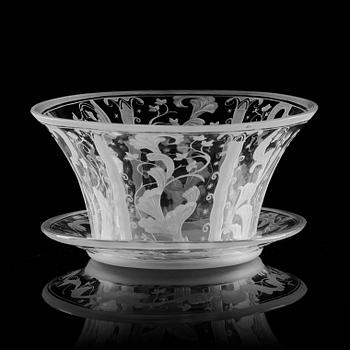 Simon Gate, a Swedish Grace engraved glass bowl with stand, Orrefors 1930, model 147, engraved by Karl Rössler.