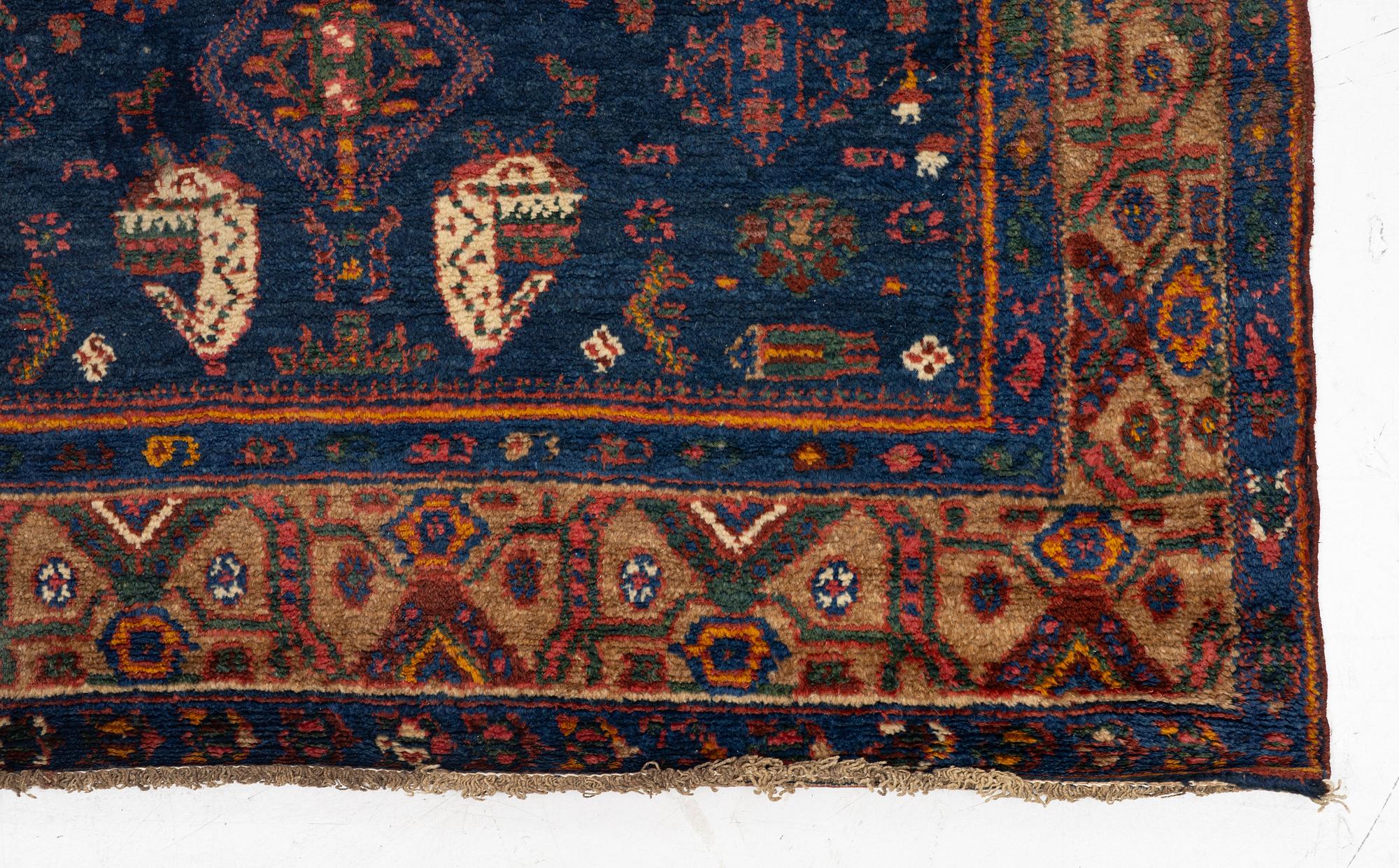 A semi-antique Northwest Persian runner, c. 388 x 94 cm.
