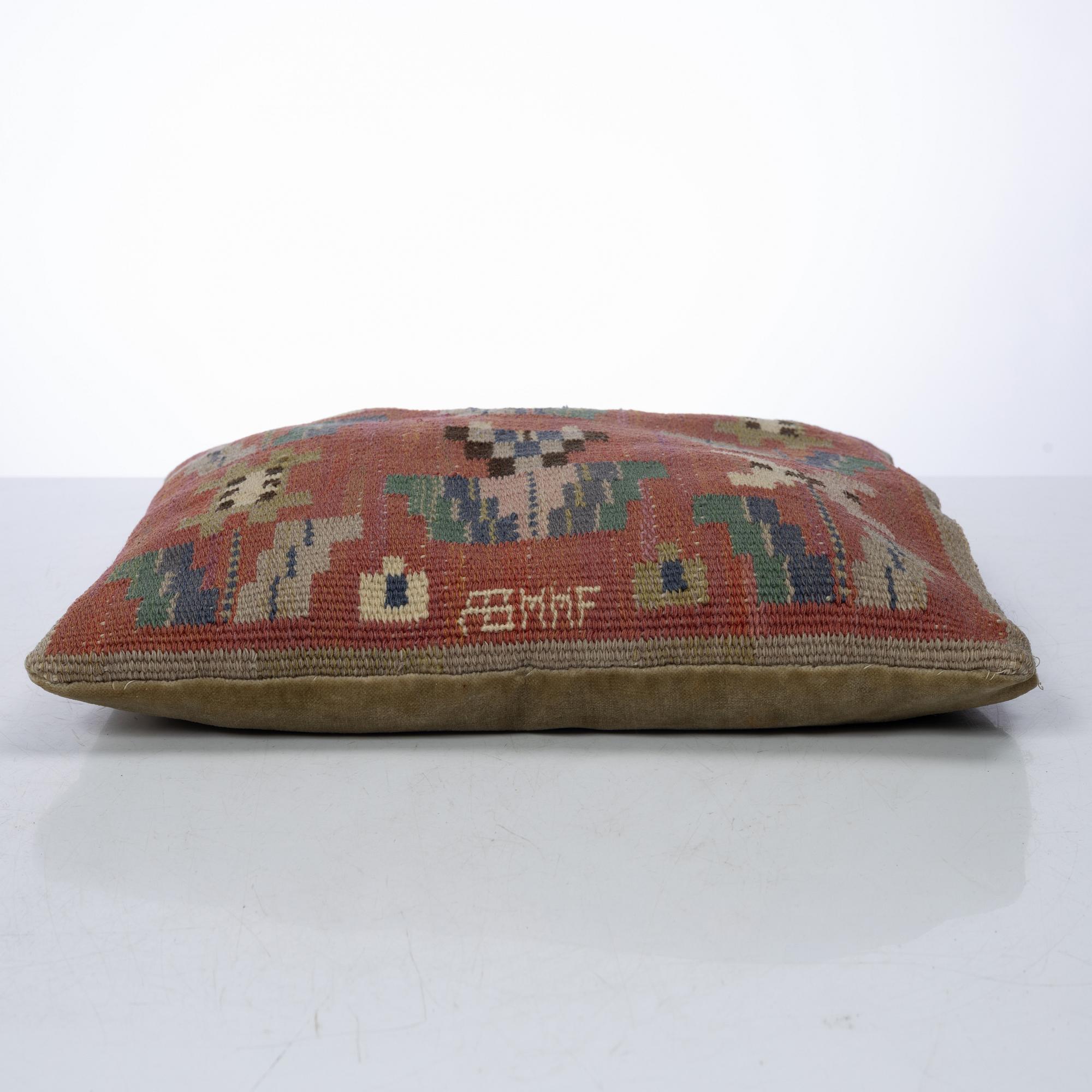 Märta Måås-Fjetterström, a cushion, 'Blommor på röd botten', signed AB MMF, ca. 31 x 31 cm.