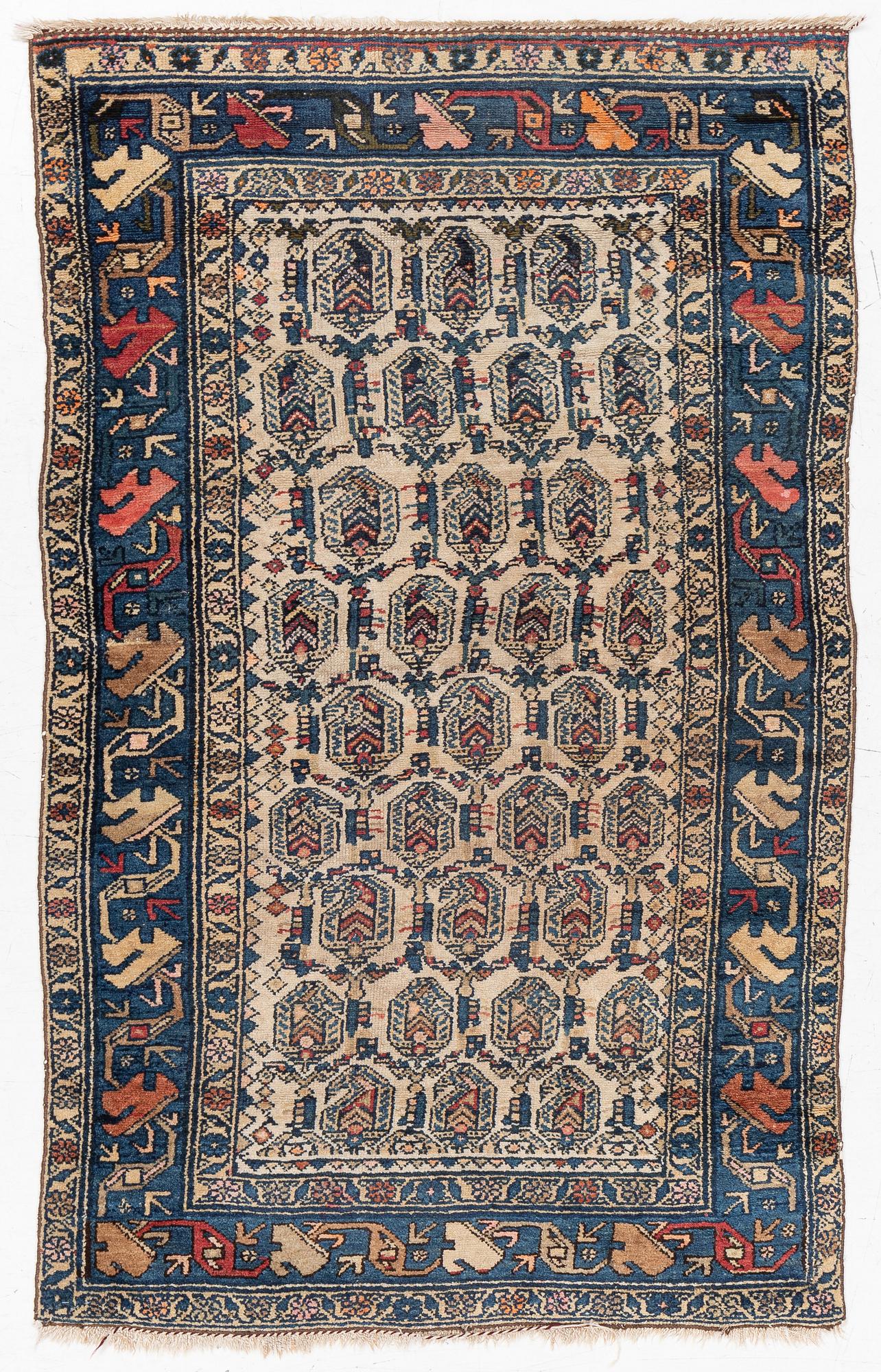An antique Hamadan rug, c. 188 x 114 cm.