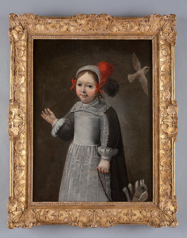Young girl with dog and bird.