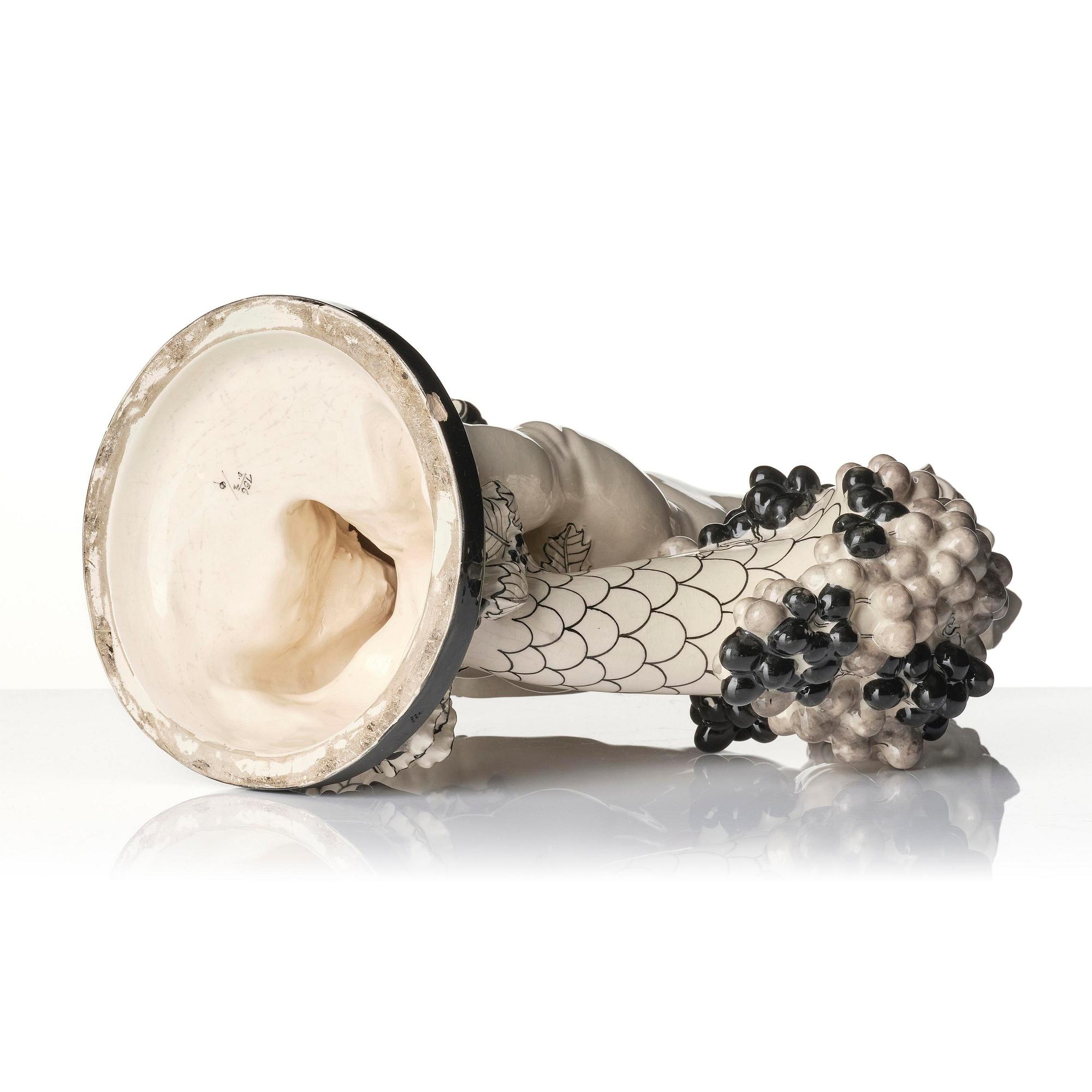 Bertold Löffler, a ceramic sculpture of a putto with cornucopia, model 156, Wiener Keramik, Vienna, Austria, 1908- 1912.