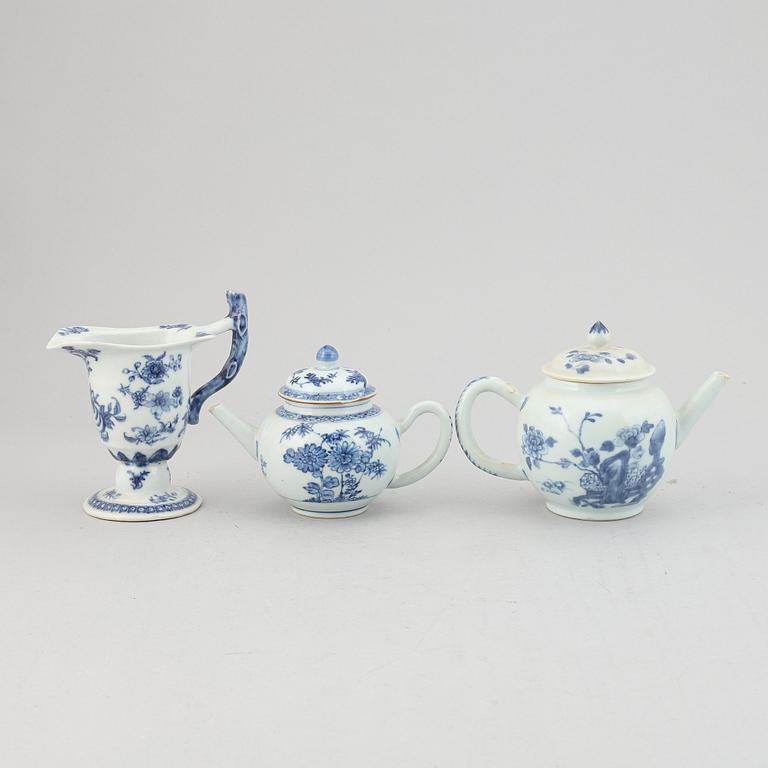 Two blue and white tea pots with cover and a milk jug, Qing dynasty, Qianlong (1736-95).