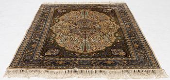 A Tabriz rug, a. 214 x 137 cm.