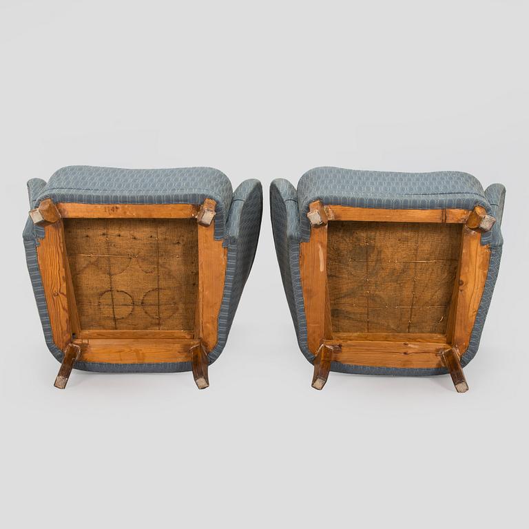 A pair of mid-20th century armchairs.