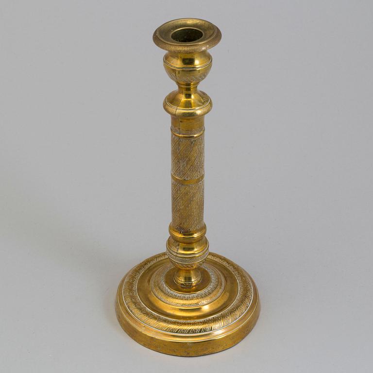 AN EMPIRE ORMOLU CANDLESTICK, first half of the 19th century.