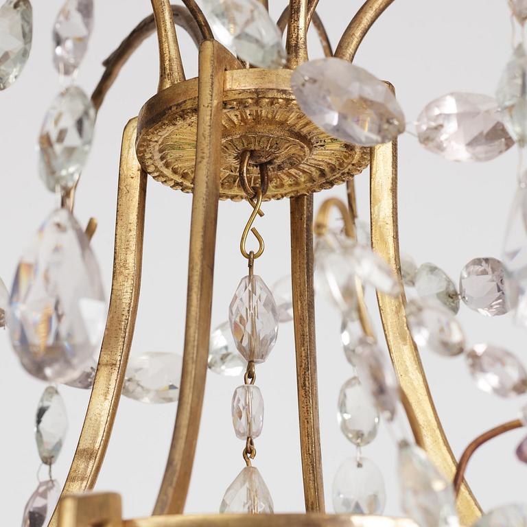 A German Louis XVI ormolu and cut-glass nine-light chandelier attributed to Johann Christoph Ermisch, late 18th century.