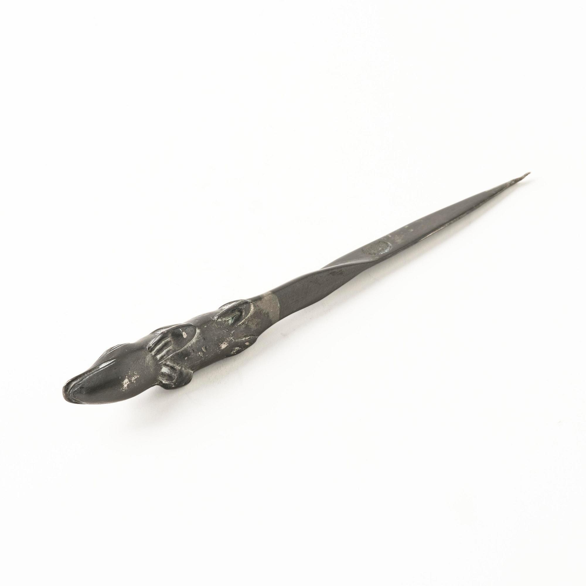 Firma Svenskt Tenn, a pewter hand mirror model A 1497 and a letter opener in the shape of an alligator, Stockholm, 1930s-40s.