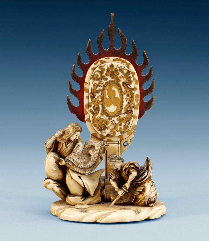 A Japanese lacquered ivory figure group, Meiji (1868-1912).