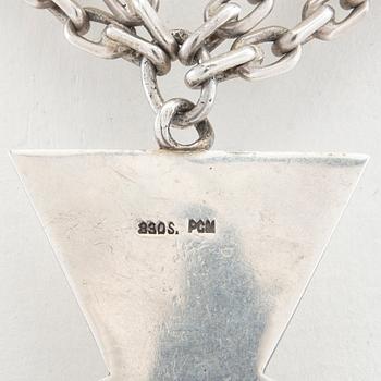 Necklace of silver in the form of a cross with faceted glass.