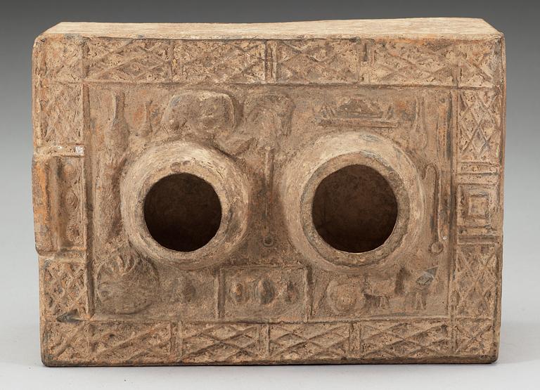A potted model of a stove, Han dynasty (206 BC - 220 AD).