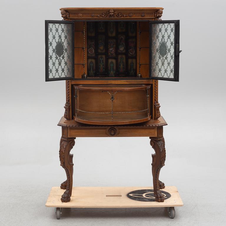 A Baroque style drinks cabinet, first half of the 20th Century.