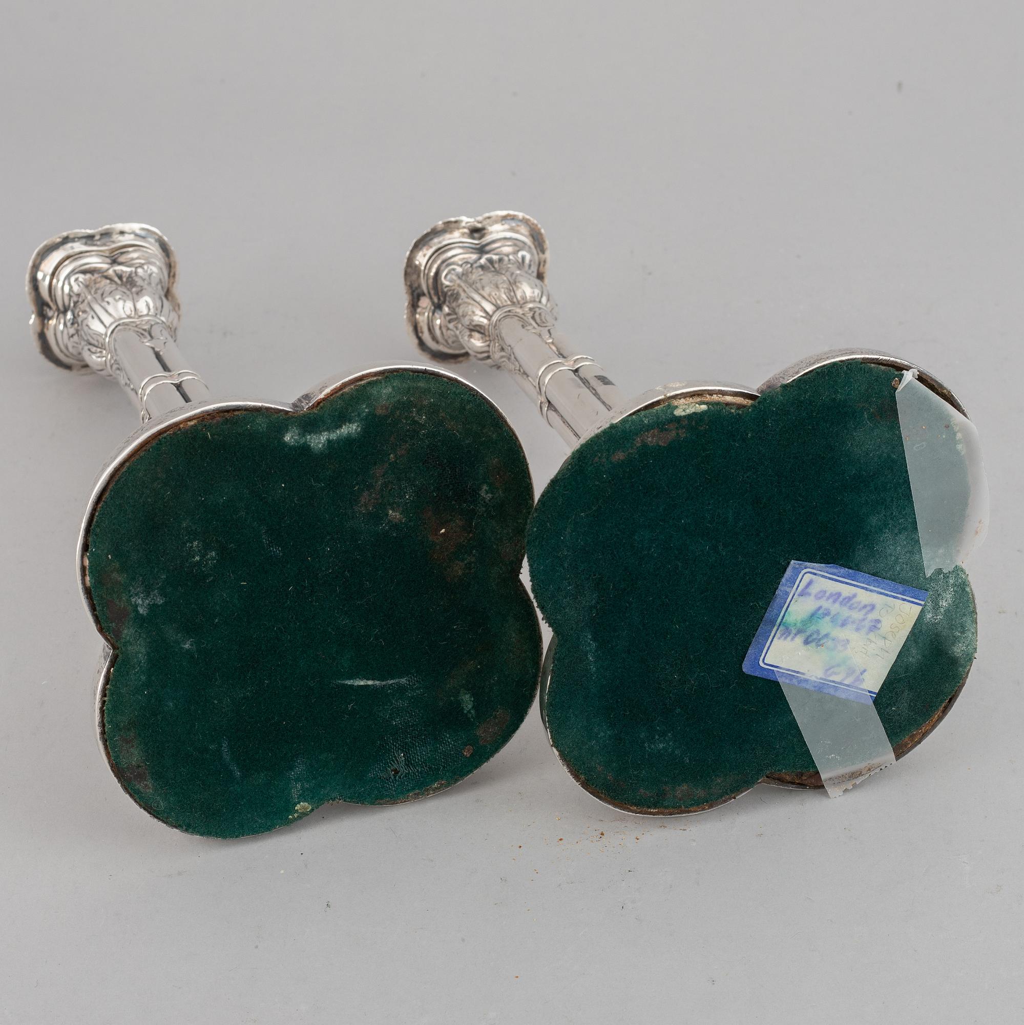 A pair of English 18th century silver candlesticks, marked JB, London 1766.