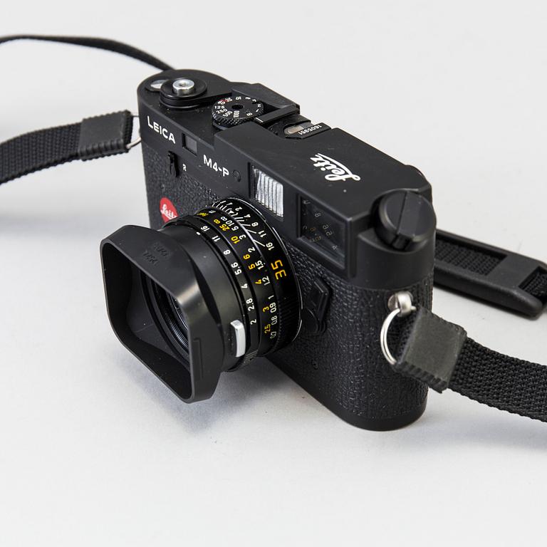 a black body Leica M4-P camera with no 1605951 made by Leitz Canada in 1982. With two lenses and a Leica Meter.