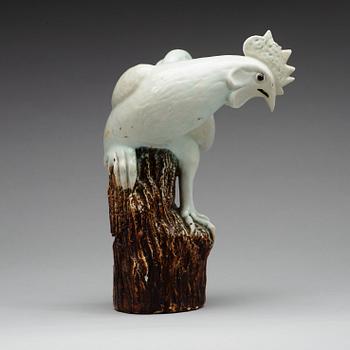 A white glazed figure of a rooster, Qing dynasty (1644-1912).