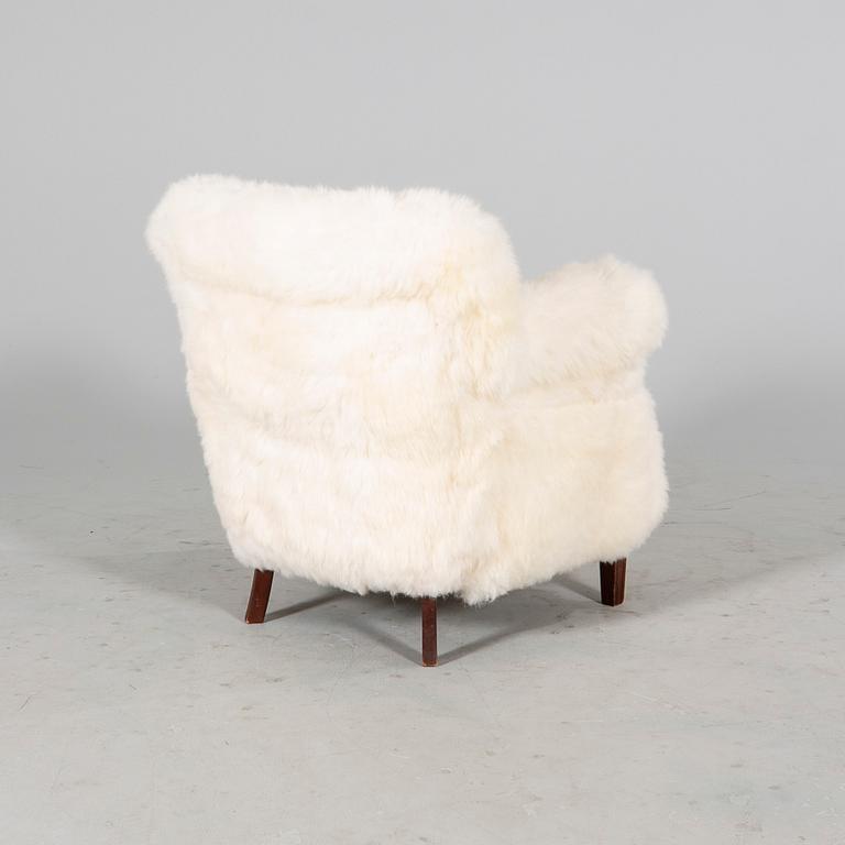 A 1940/50s cheep skin armchair.