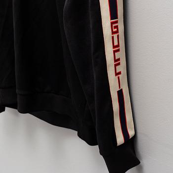 GUCCI, a polyester t-shirt and hoodie.