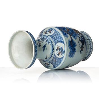 A blue and white and iron red vase. Qing dynasty, 19th century.