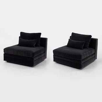 Two 21st century lounge chairs.