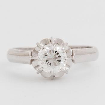 A round brilliant-cut diamond ring.