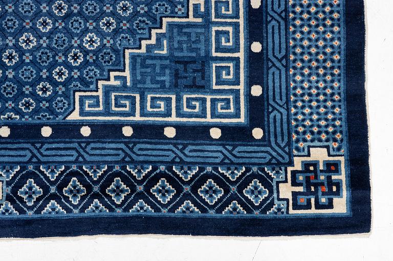 A semi-antique Baotou carpet, West China, c. 335 x 246 cm.