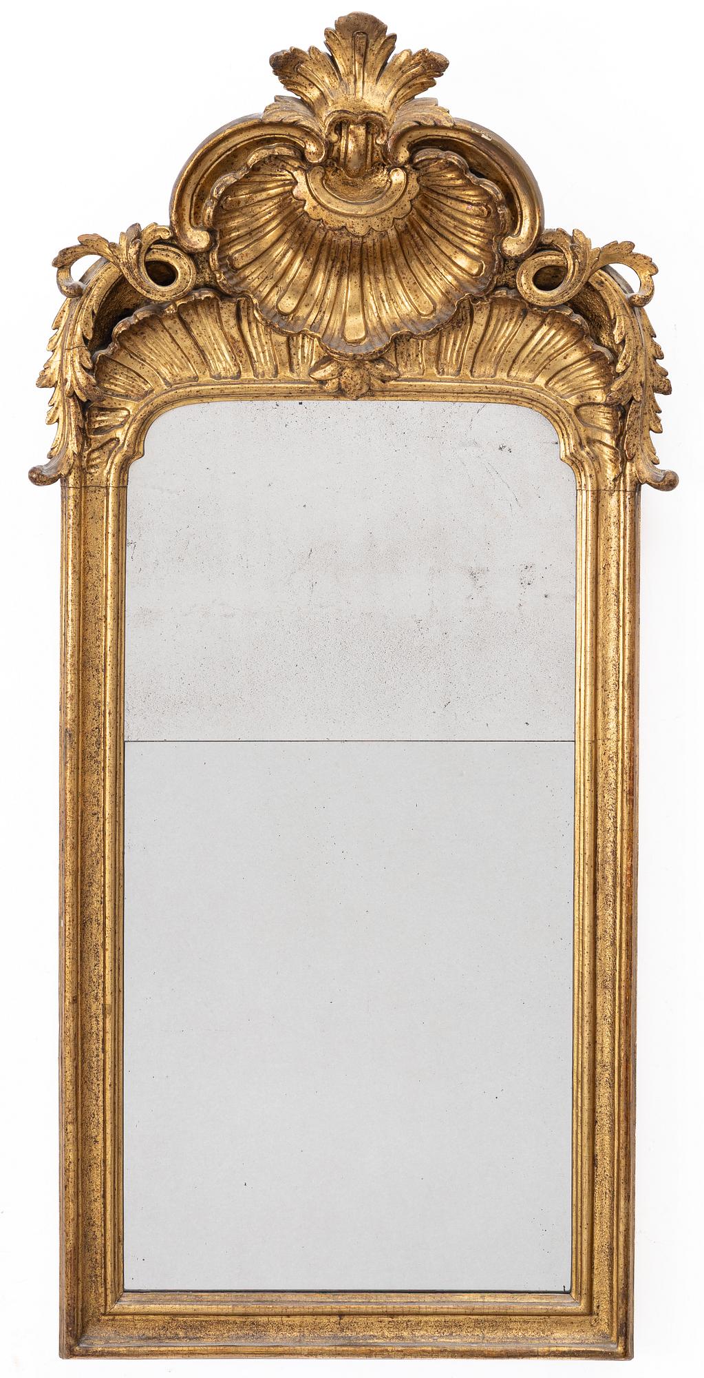 A Rococo mirror, 18th century.