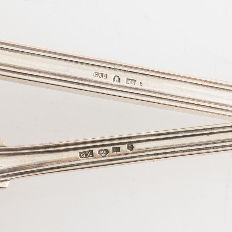Two Swedish 19th century soup ladles, the small in silver, mark of Gustaf Möllenborg and the large in silver plate.