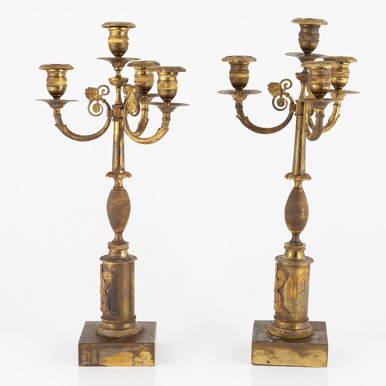 A pair of Empire ormolu four-branch candelabra, early 19th century.