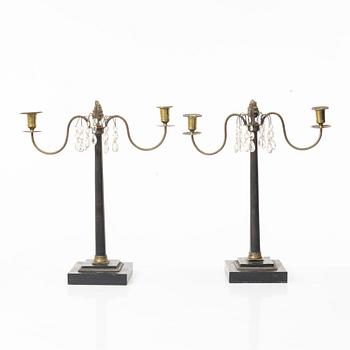 A pair of wooden candelabras, around 1900.