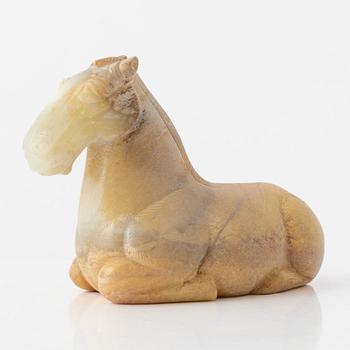 A carved nephrite figure of a reclining horse, 20th Century.