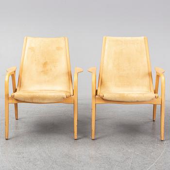 A pair of Laminett Yngve Ekström chairs.
