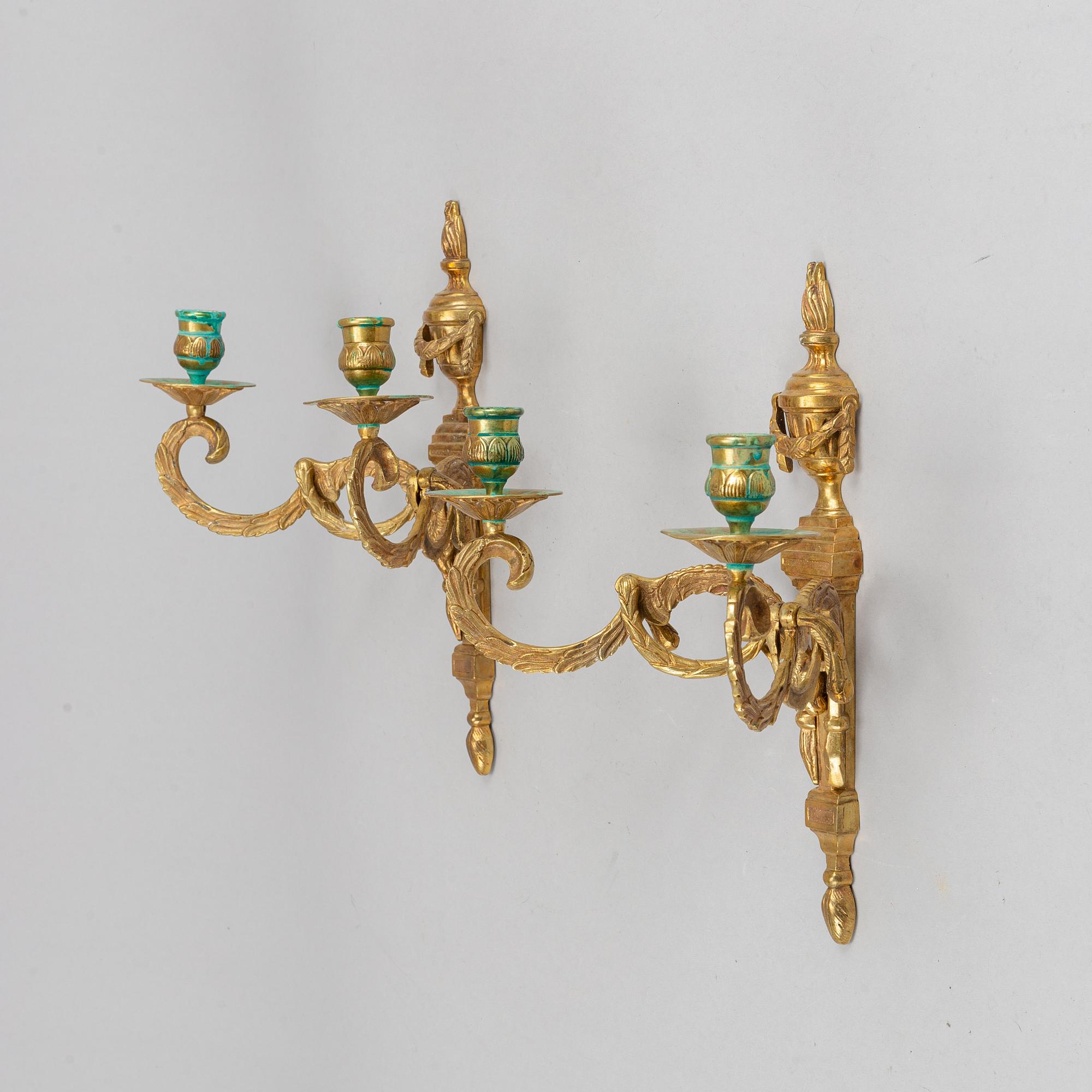 A pair of wall sconces, Louis XVI style, early 20th century.