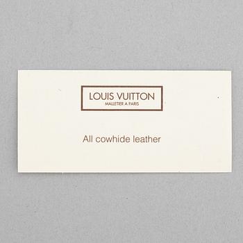 Louis Vuitton, a black, embossed leather wallet, 2015.