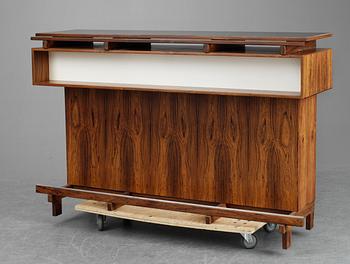 A Danish palisander bar by Dyrlund Smith, 1960´s, with four stools, marked AB COCKTAIL MÖBLER.