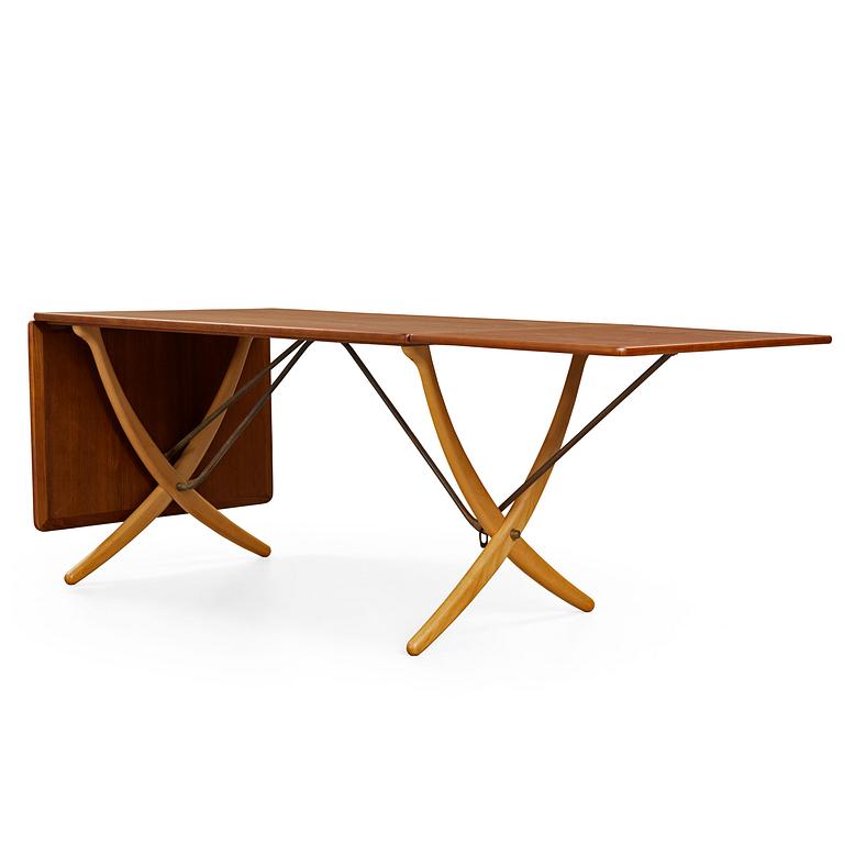 A Hans J Wegner teak and beech dinner table by Andreas Tuck, Denmark 1950-60's.