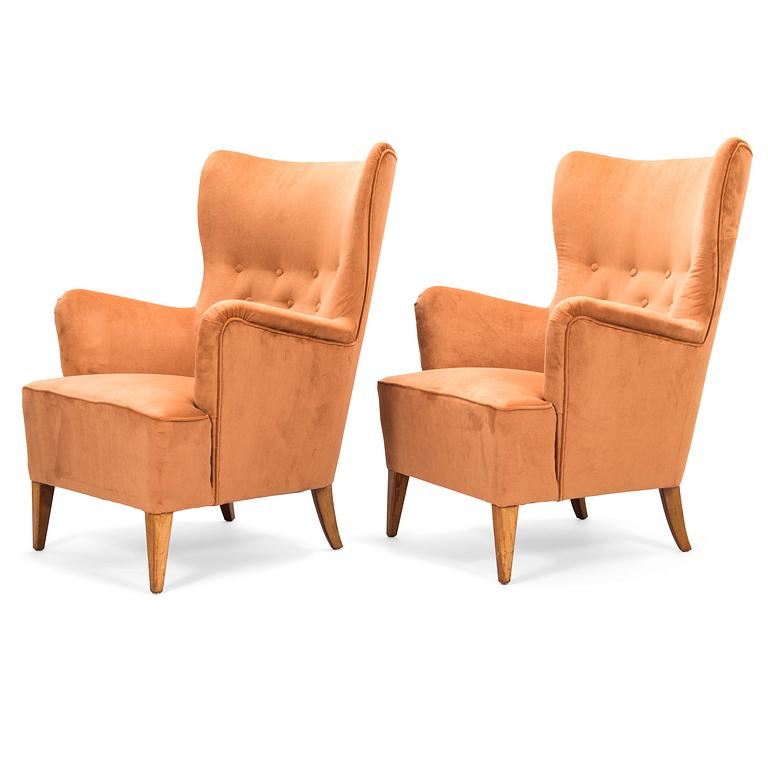 A pair of 1950's open arm chairs for Oy Paul Boman Ab.