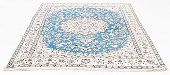 A Nain carpet, circa 310 x 196 cm.
