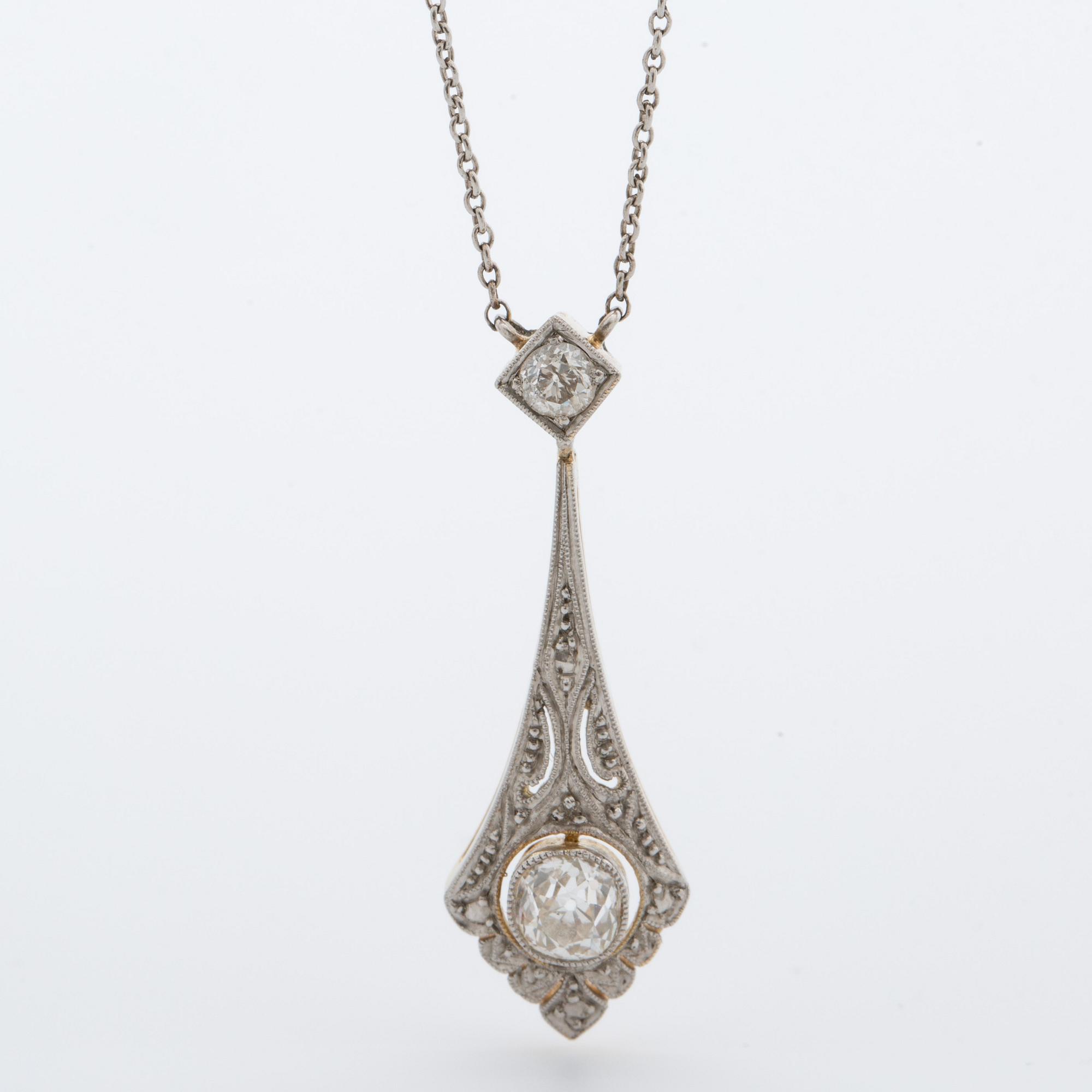 A pendant with a pair off earrings with old-cut diamonds ca 1.10 cts. 1920.
