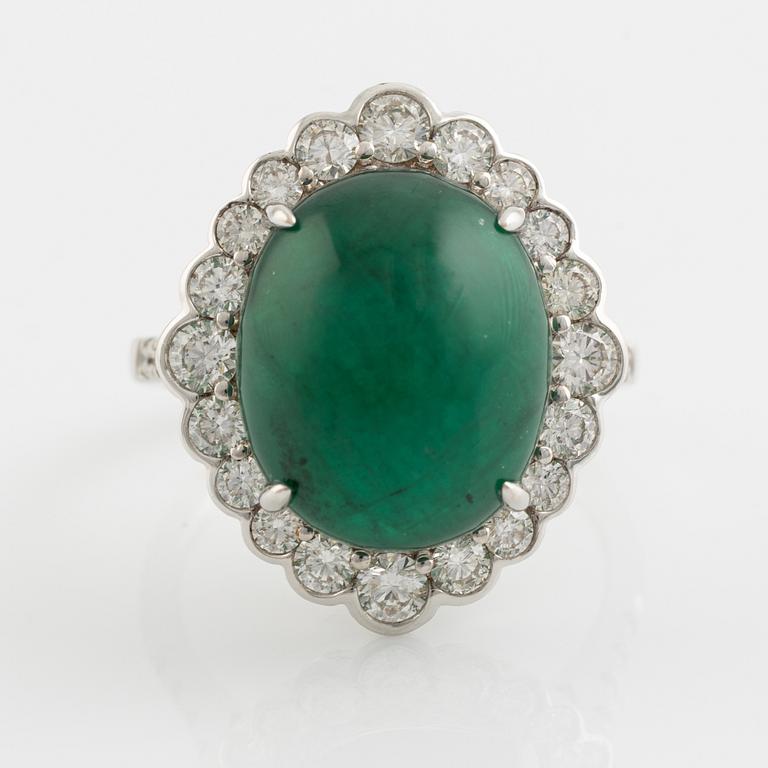 Cabochon cut emerald and brilliant cut diamond ring.