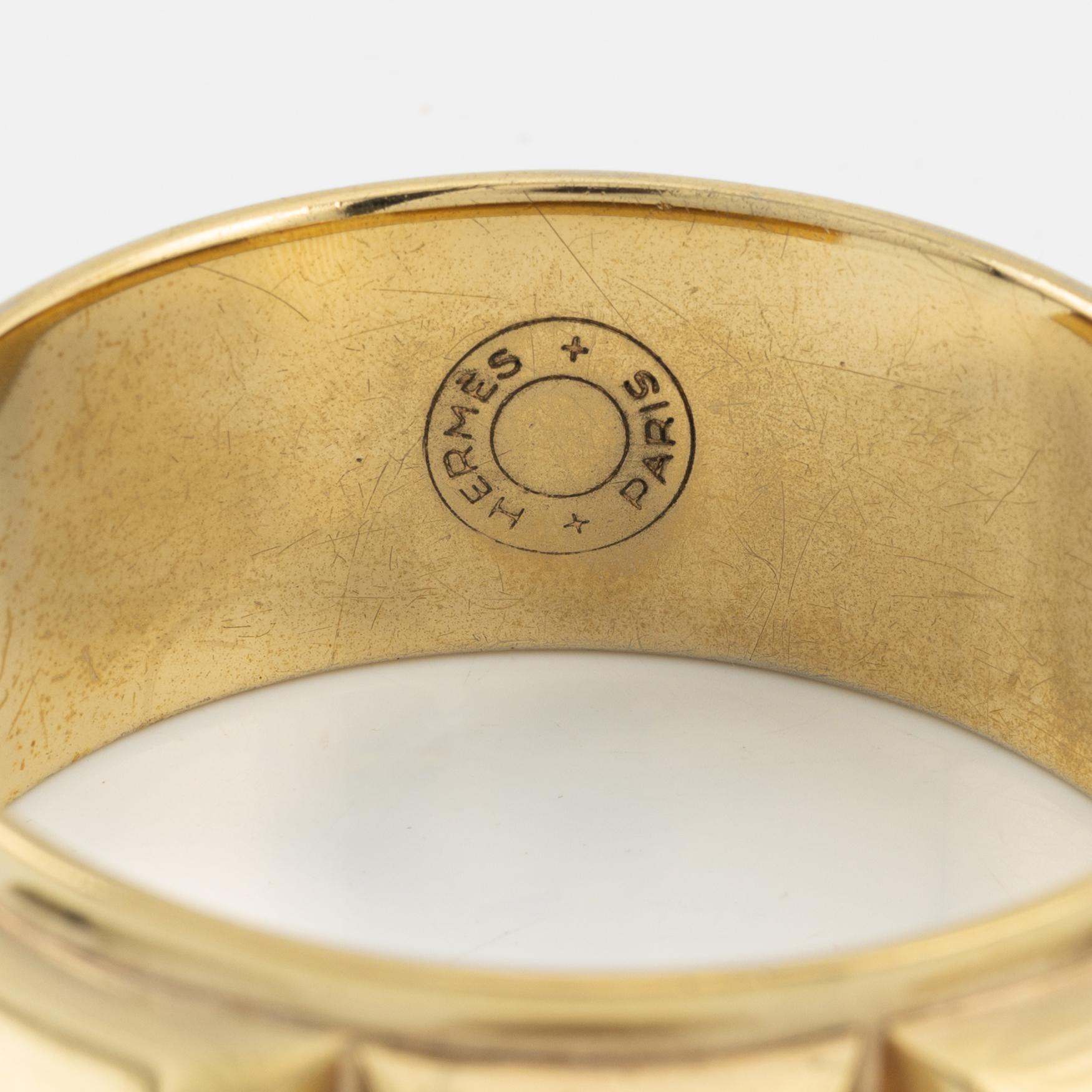 Hermès, a vintage gold tone stud bangle.