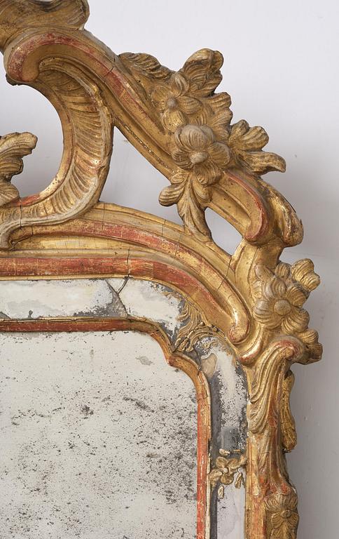 A Swedish Rococo mirror, 18 th century.