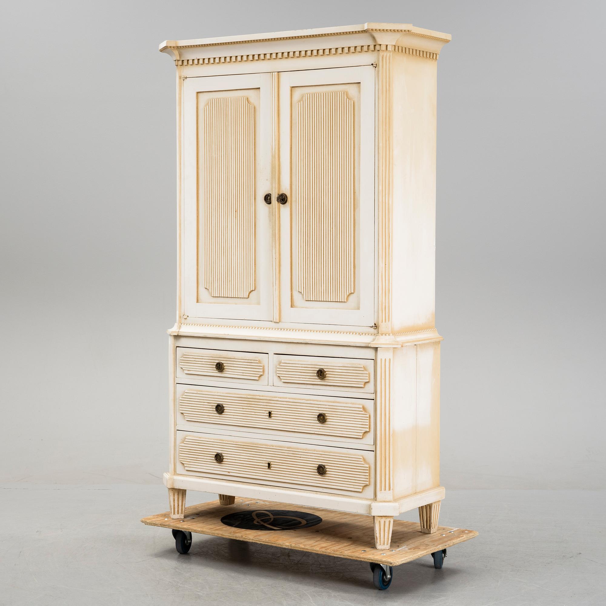 A gustavian style cabinet, circa 1900.