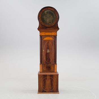 A 19th century Longcase Clock with arched brass dial inscribed Thomas Atkinson, Ormskirk, England.