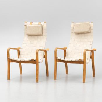 Yngve Ekström, a pair of "Primo" armchairs with ottomans, Swedese, Sweden,