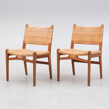 Hans J. Wegner, a pair of teak "CH31" chairs, Carl Hansen & Søn, Denmark, second half of the 20th century.