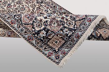 A rug, Nain, part silk, ca 196 x 120 cm.