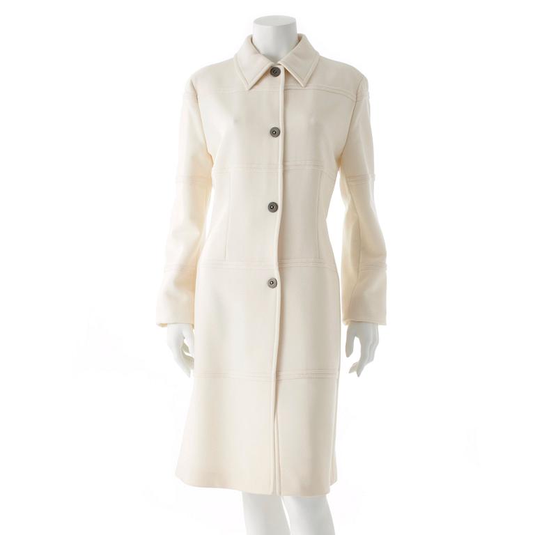 CARACTÈRE, a white wool coat.