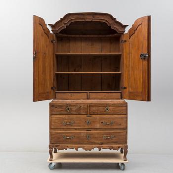 a 1700's Rococo pine cabinet.