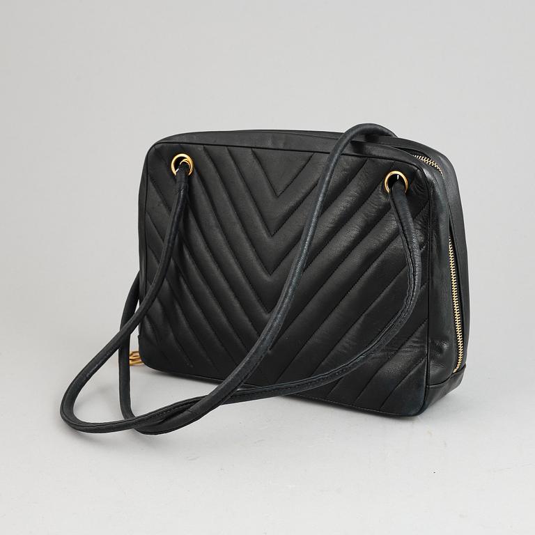 Chanel, a black leather handbag, 1980's.